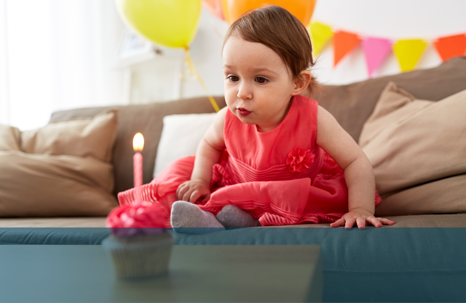 child blowing candle