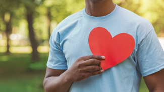 guy with big red heart