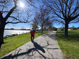 A person walking in India Point Park